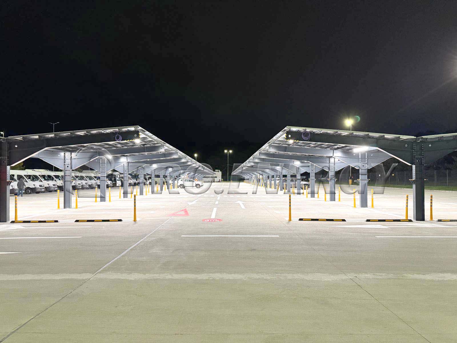 Completed PROFENCE.ENERGY solar carport project in European parking lot at night